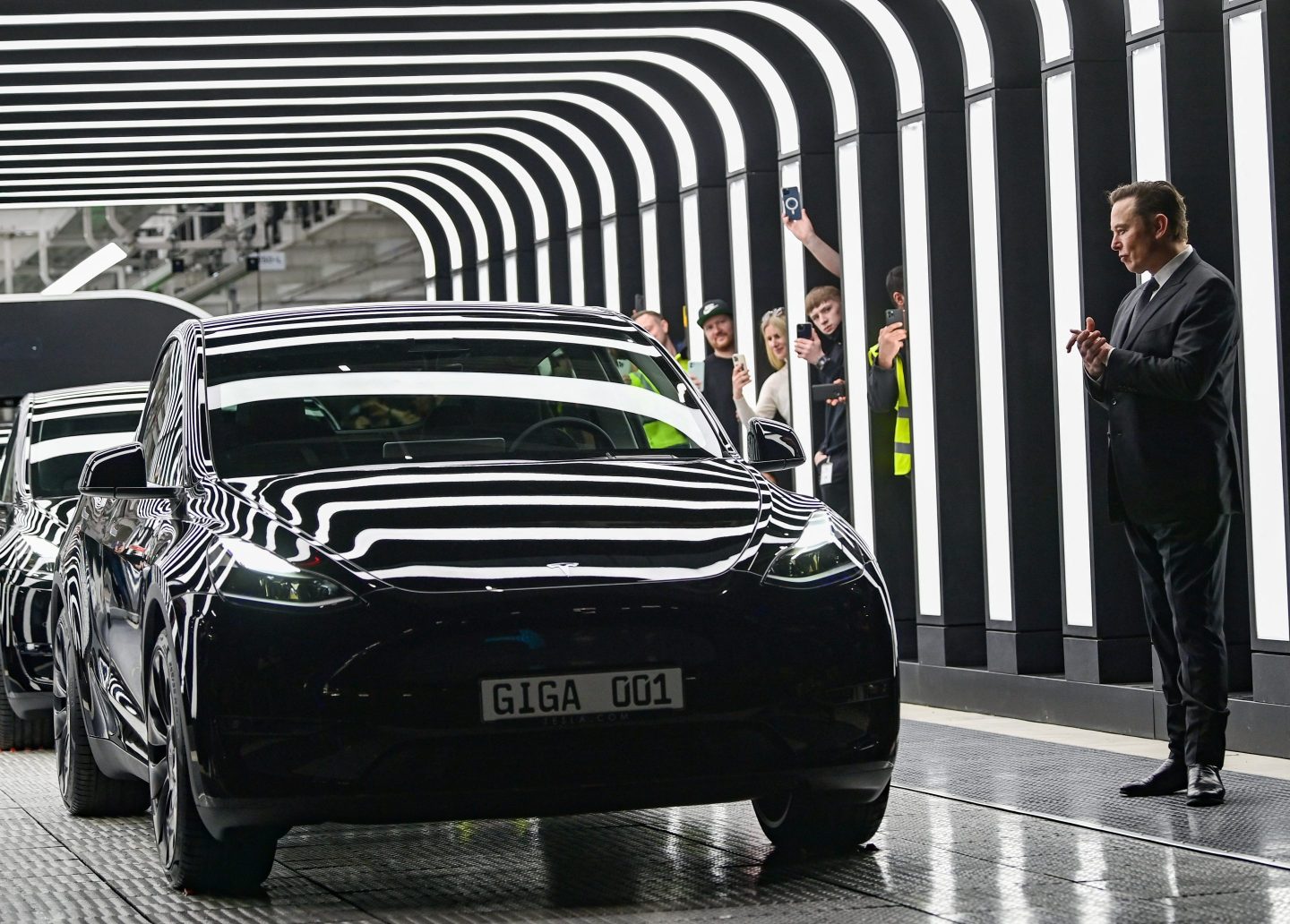 Elon Musk predicts ‘agonizingly slow’ Cybercab and Optimus rollout. But he’s not giving up on Tesla’s big bet on robots
